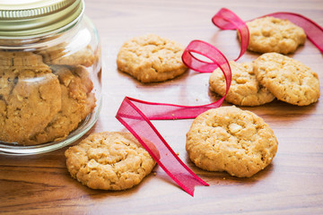 Butter cookies with red ribbon and bottle