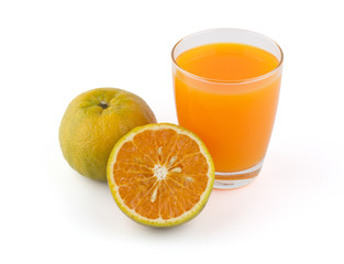 Glass of orange juice and sliced orange