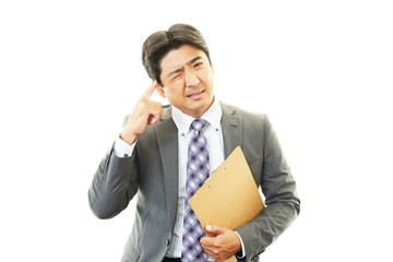 頭痛を訴えるビジネスマン