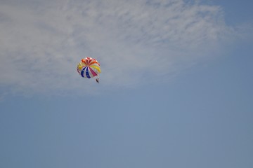 Paraglider on the sky dragged by boat. Zlatni Rat, Croatia