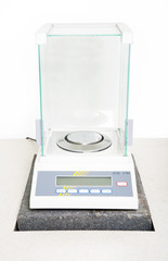 Laboratory scale on table white background