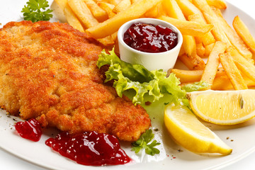 Pork chop, French fries and lingonberry jam