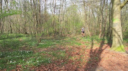 Father and Son running in the forest 