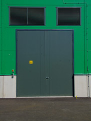 Obraz na płótnie Canvas Factory gate with ventilation grilles.