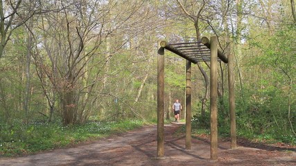 Young man working out in the forrest 