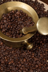 coffee beans and old brass cup