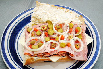 Vegetables on Top of a Ham and Cheese Sandwich