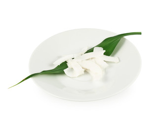 Plate of coconut's chips isolated