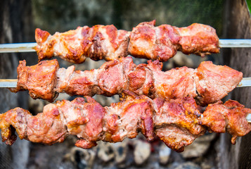 Hot shish kebab on metal skewers