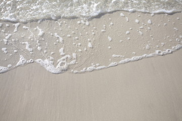 Fototapeta na wymiar close - up sand beach water as summer background