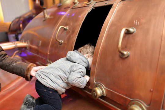 Child Looking At Tank