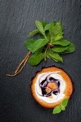 Cake muffins with cream cheese and  blueberries