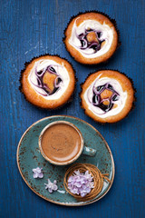 Cakes with berries and cup of espresso
