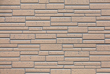 new brown tiles wall as background and texture