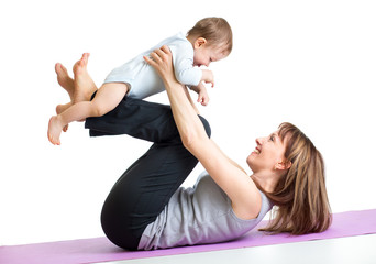 Fototapeta na wymiar mother with baby do gymnastic exercises