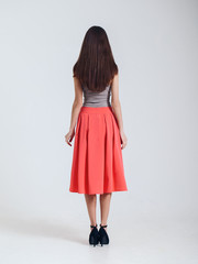 Girl in beautiful skirt. Catalogue shoot. Isolated on white back