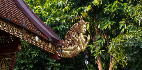Ornate designed Thai roof at Wat Pra Sing, Chiang Rai, Thailand