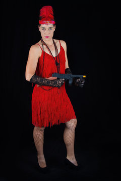 Dangerous beautiful brunette in 1920 style attire red dress feat