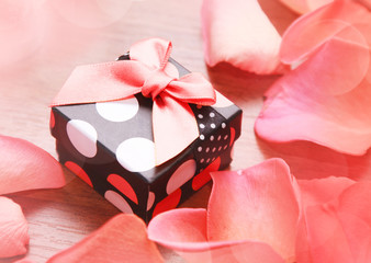 Gift box with bow and petals