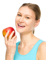 Young happy girl with apple