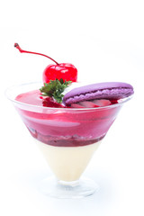 Strawberry shot cake with cherry and macaron