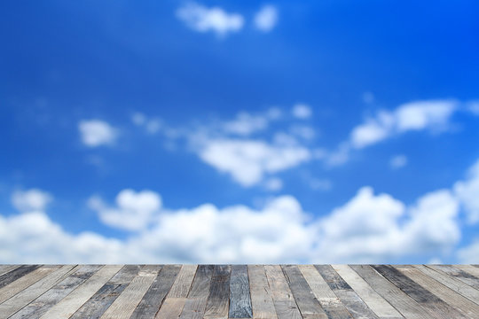 Blue sky above a wooden floor