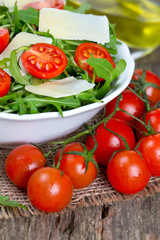 fresh salad from rucola, cherry tomatoes and parmesan cheese