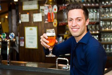 Happy man with glass of beer