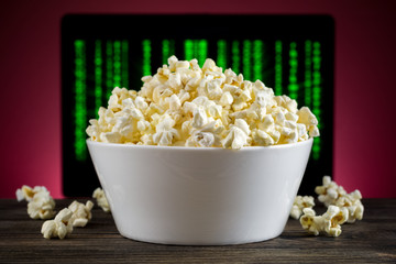 Popcorn on the table TV in the background