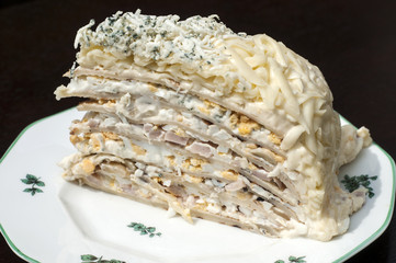 Homemade salty pancake cake piece in plate