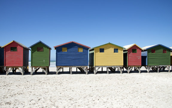 Wooden beach huts in various colours at Muizenberg Western Cape