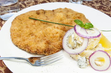 Schnitzel vegetable salad at restaurant