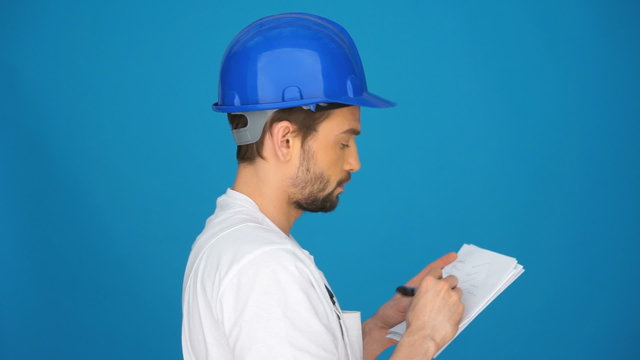 Builder referring to a page of notes