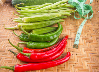 Vegetables and Measuring Tape On Wicker Tray