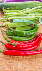 Vegetables and Measuring Tape On Wicker Tray