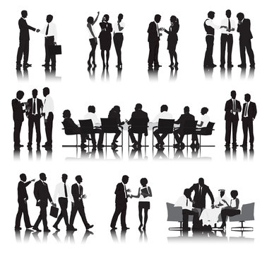 Silhouettes of Business People in a Row Working