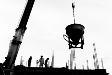 silhouette labor working in construction site