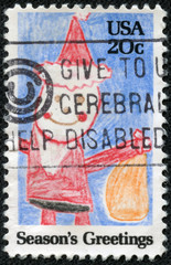 stamp shows child drawing of Santa Claus