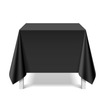 Square table covered with black tablecloth