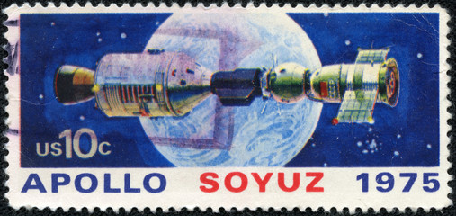 stamp printed in USA shows space satellite, apollo soyuz