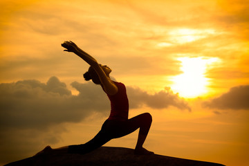 Young asian woman practicing yoga