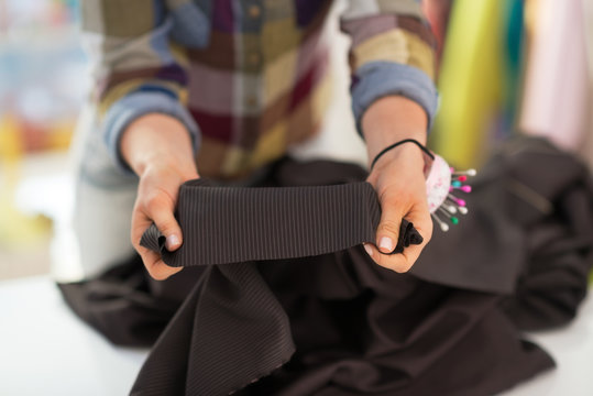 Closeup on seamstress showing fabric