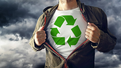 Man stretching jacket to reveal shirt with recycle symbol printe - obrazy, fototapety, plakaty