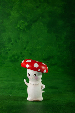 cute puppets handmade, one mushroom, green background