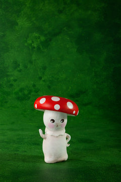 cute puppets handmade, one mushroom, green background