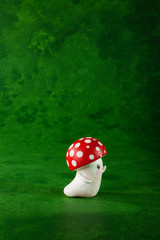 cute puppets handmade, one mushroom, green background