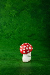cute puppets handmade, one mushroom, green background