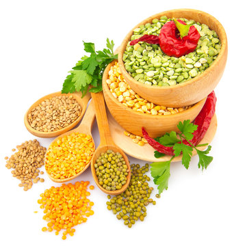 Lentil bean in wooden plate with spice, isolated on white,
