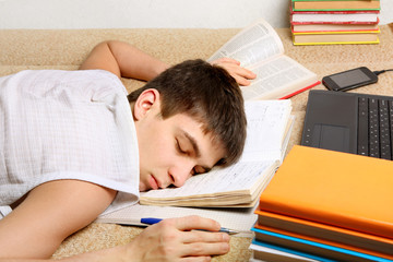 Teenager sleeps on the Books