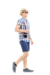 Profile shot of a male tourist walking